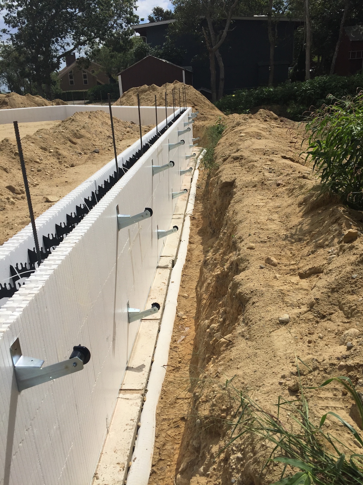 An ICF wall is seen with brackets in place to align the walls when the concrete will be poured.