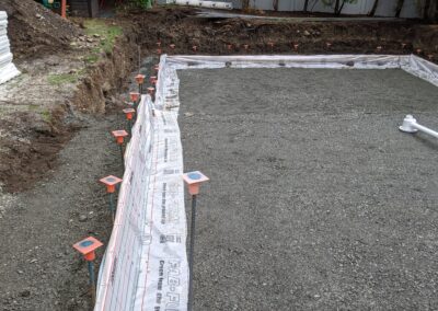 Base layer of gravel prepare for first set of ICF forms for an energy efficient pool built with ICF forms