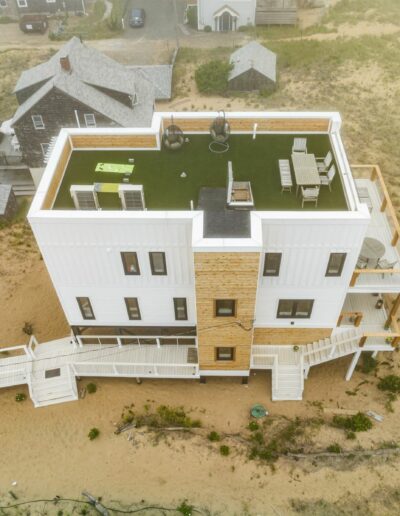 User Plum Island's beachfront property with drone footage capturing the Top Side view of an ICF (Insulated Concrete Form) home