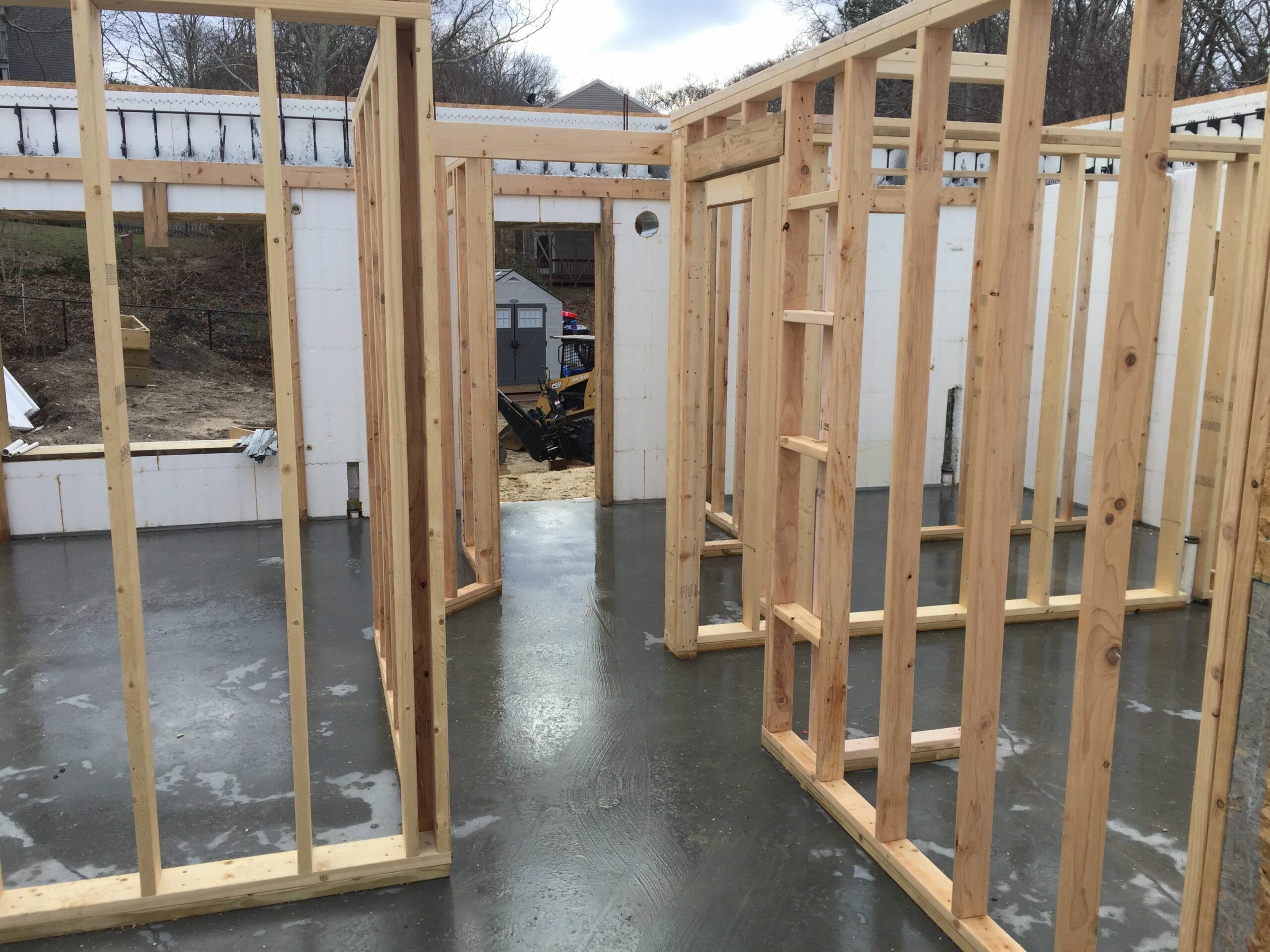 internal wooden framing of a new ICF project. The ICF walls are seen surrounding the framing.