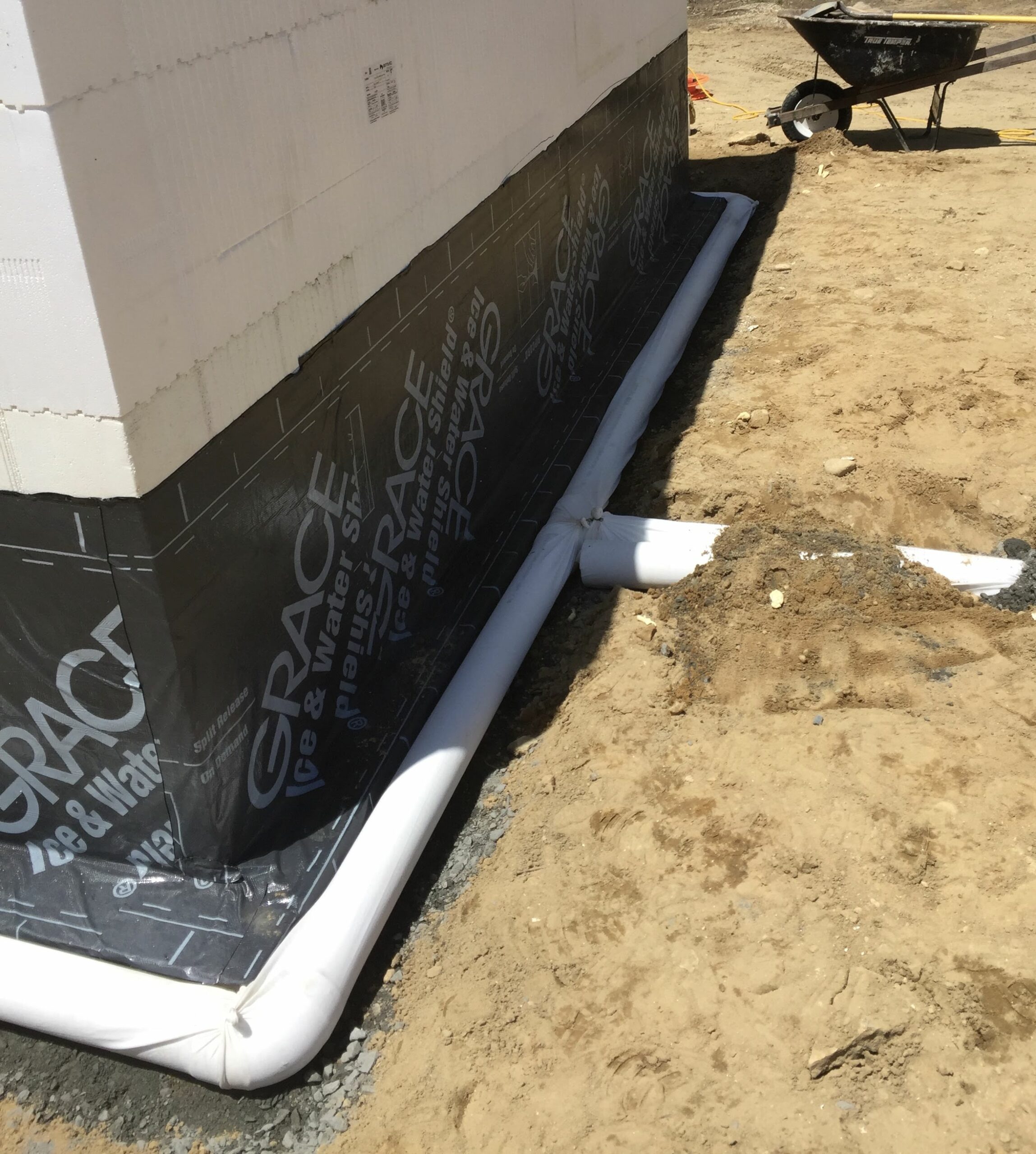 Perforated Pipe with Permeable Cover for Waterproofing Foundation of ICF Home is seen in a t style to draw water away from the home