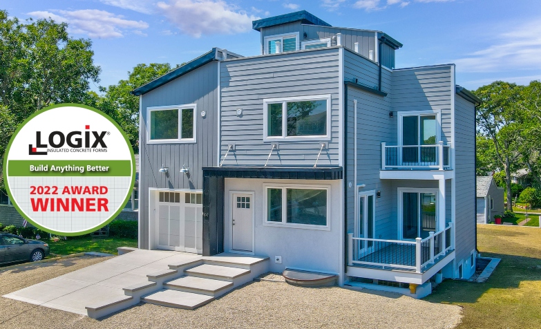 Award Winning ICF Home with beautiful colonial / modern style with gray siding and white framing.